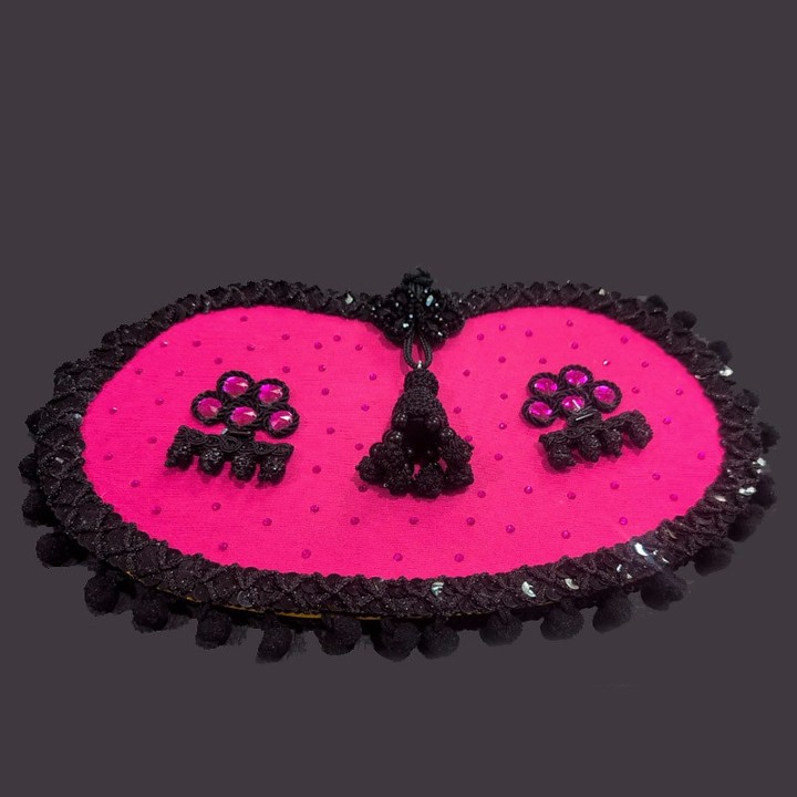Stierkampf-Clutch in Capote-Fuchsia mit goldenen Alamares