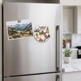 Round Madrid landmarks collage magnet on a fridge door