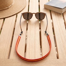 Spanish flag glasses strap on sunglasses on a terrace table