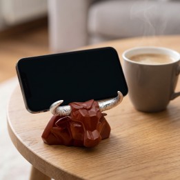 Support de téléphone en céramique tête de taureau sur une table basse