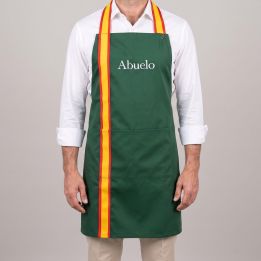 Personalised Spanish flag bib apron, green, embroidered with “Abuelo”, worn by a man
