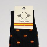 Close-up of the label and pattern of the black Spanish flag socks