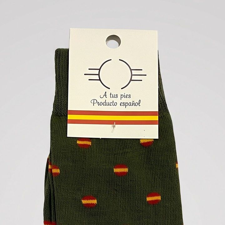 Close-up of the label and pattern of the green Spanish flag socks