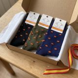 Three pairs of Spanish flag socks in a gift box